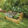 Carré potager ANGELIC 140L vue de 3/4 en situation dans un jardin avec des plantations dedans