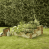 Carré potager ANGELIC 154L vue de 3/4 en situation dans un jardin avec des plantations dedans