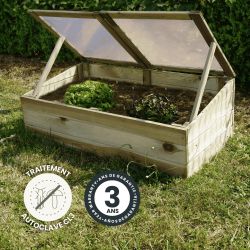 Zoom sur la serre de jardin en situation, avec des icônes spécifiant son traitement et sa garantie