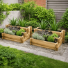 Deux carrés potager ANGELIC 140L vue de 3/4 en situation dans un jardin avec des plantations dedans